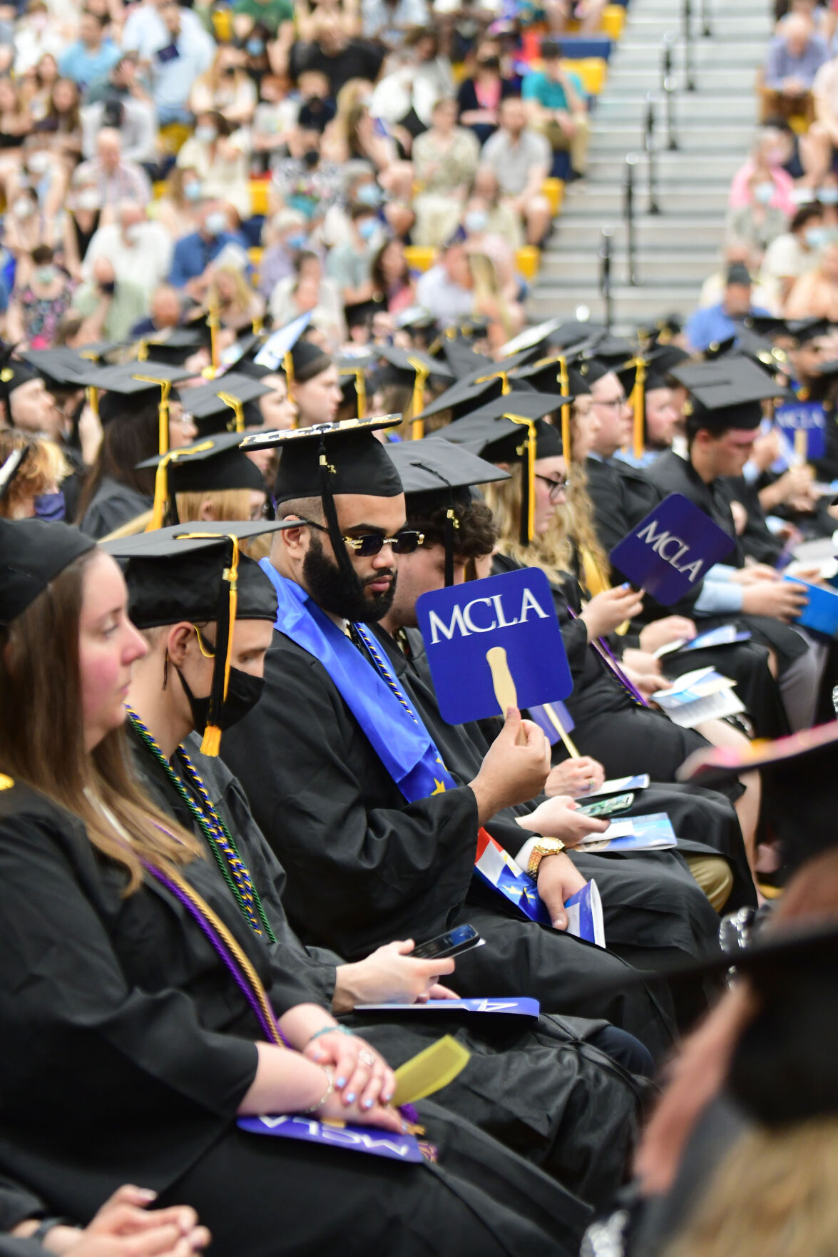 Graduates sit in their seats